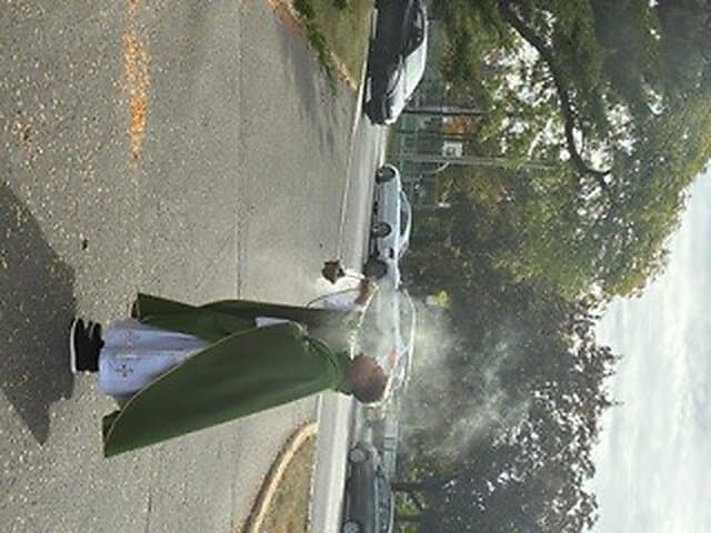 Blessing of the new cross outside Église Sainte-Angèle
