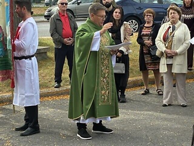Blessing of the new cross outside Église Sainte-Angèle